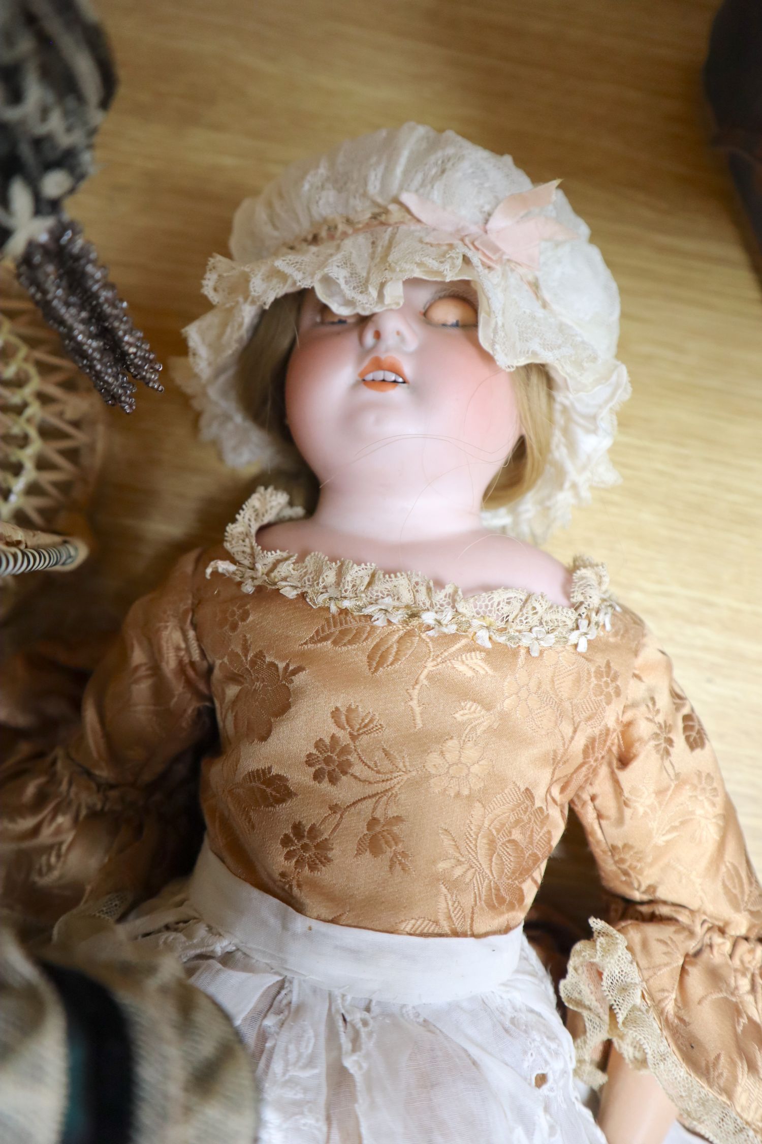 A small collection of bisque head dolls, including a Max Oscar Arnold example